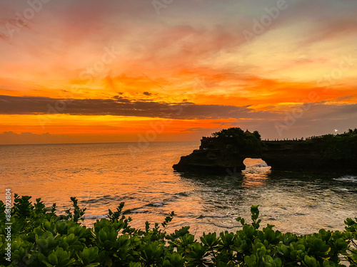 View of Tanah Lot  traditional balinese temple at sunset