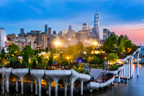 Aerial view of Lower Manhattan skyline at at dusk, behind the Little Island public park.