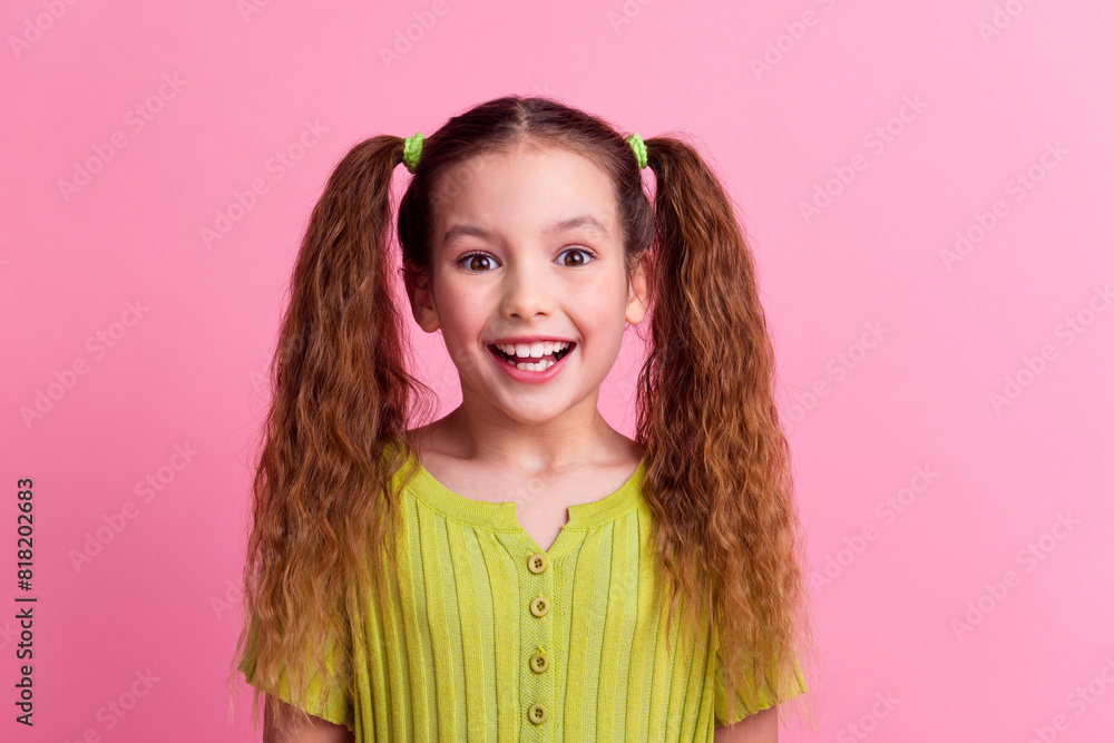Photo portrait of lovely little girl excited reaction dressed stylish green garment isolated on pink color background Photo portrait of lovely little girl excited reaction dressed stylish green garment isolated on pink color background