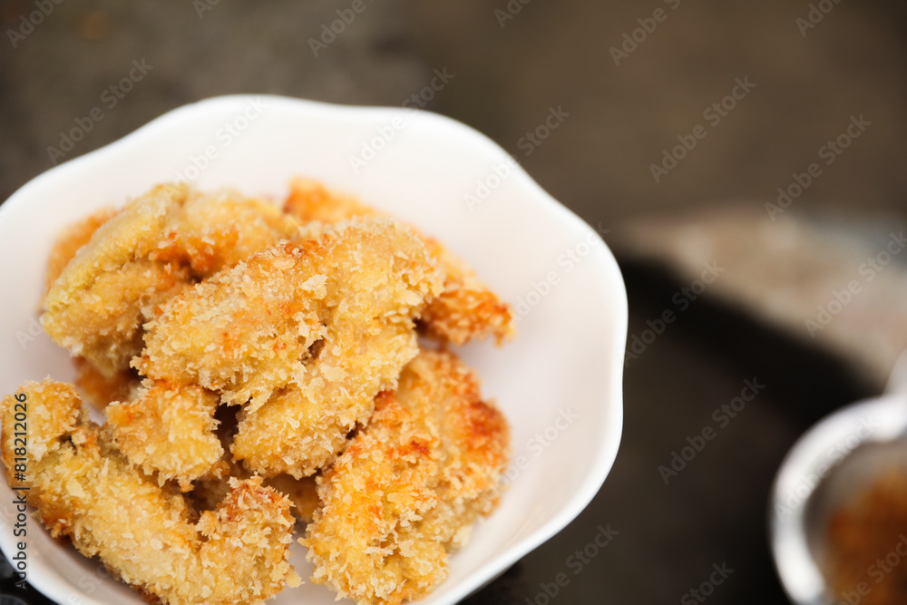 golden, crispy fried chicken pieces in bubbling oil, symbolizing indulgence and temptation golden, crispy fried chicken pieces in bubbling oil, symbolizing indulgence and temptation