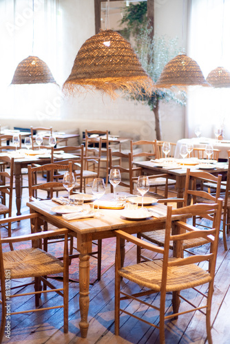 modern restaurant interior with wooden tables and chairs