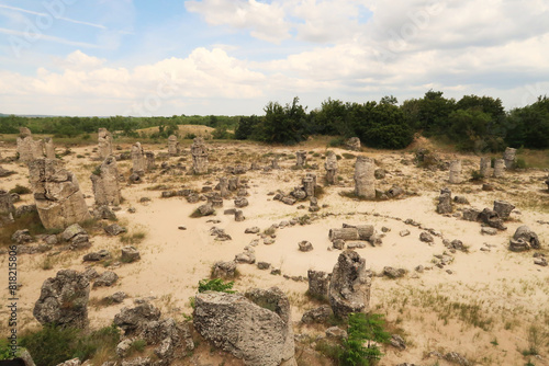 View over the stone forest of Pobiti Kamani, a stone circle between many stone pillars rising from a desert-like landscape near Varna, Bulgaria photo