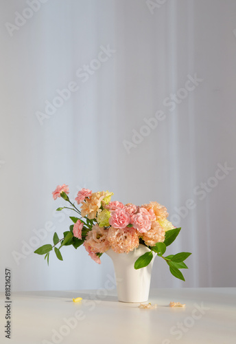 beautiful bouquet in white vase in sunlight