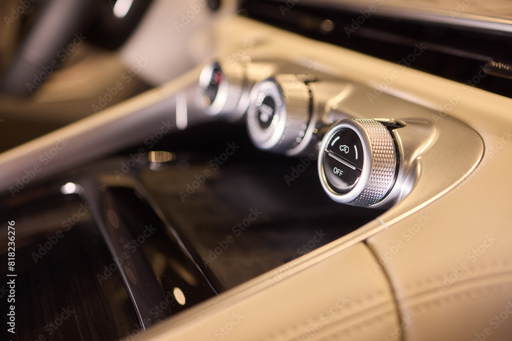 Detailed view of luxury vehicle dashboard with shifter and buttons Detailed view of luxury vehicle dashboard with shifter and buttons