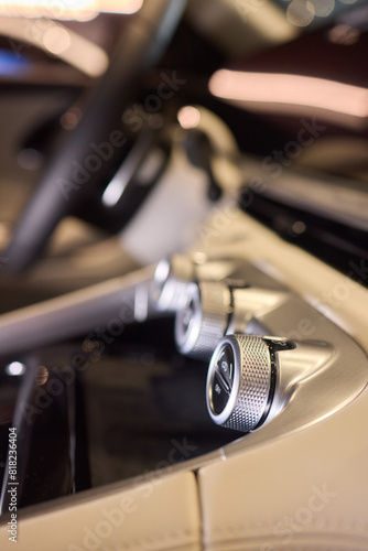 Detailed view of luxury vehicle dashboard with shifter and buttons © Евгений Вершинин