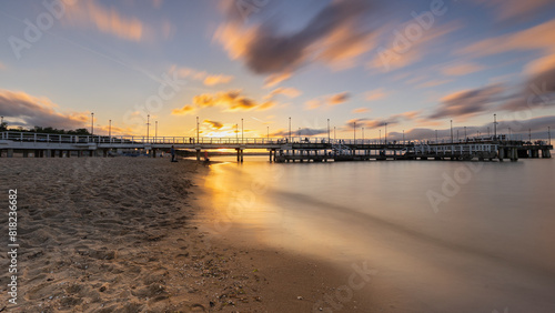 Fototapeta Naklejka Na Ścianę i Meble -  Sunset over the pier in Jelitkowo, Baltic coast