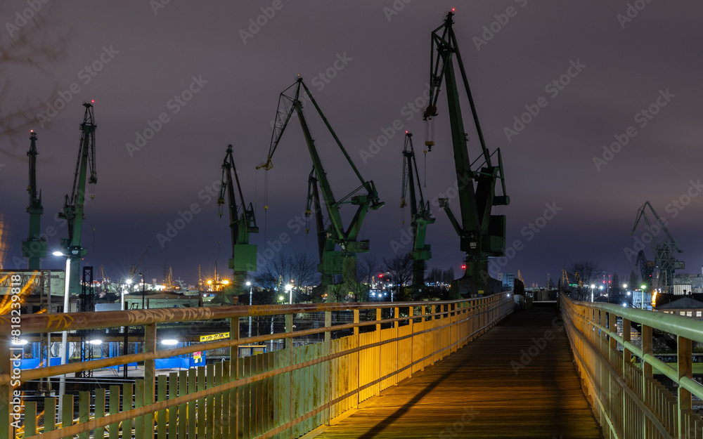 Cranes of the Gdańsk Shipyard on the Baltic coast at night