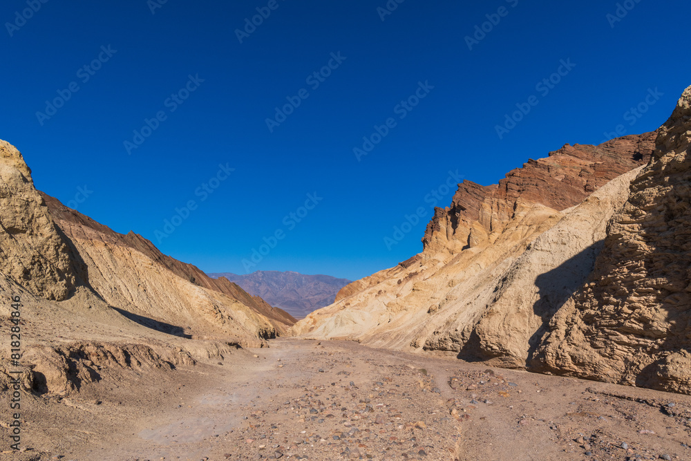 Fototapeta premium Sunrise Morning Sunshine in Golden Canyon, Death Valley National Park, California