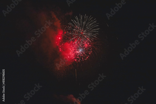 Red fireworks in the night sky