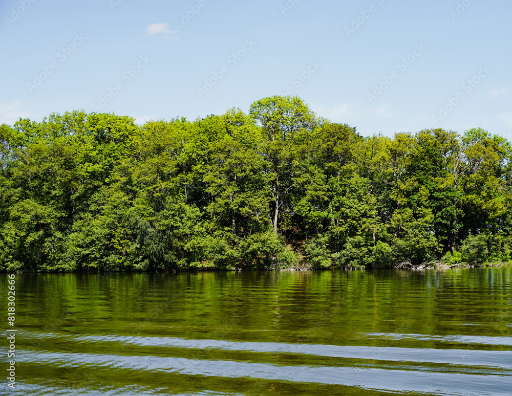 Scenic view of lake against blue sky Scenic view of lake against blue sky