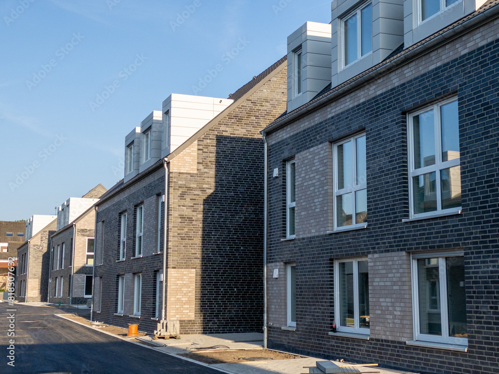 Asphalt street with newly built town houses in Germany Asphalt street with newly built town houses in Germany