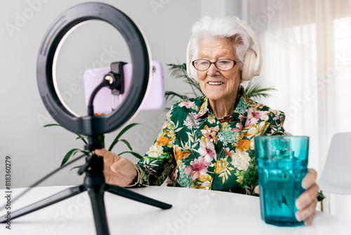 Elderly woman hosting a lively podcast recording photo