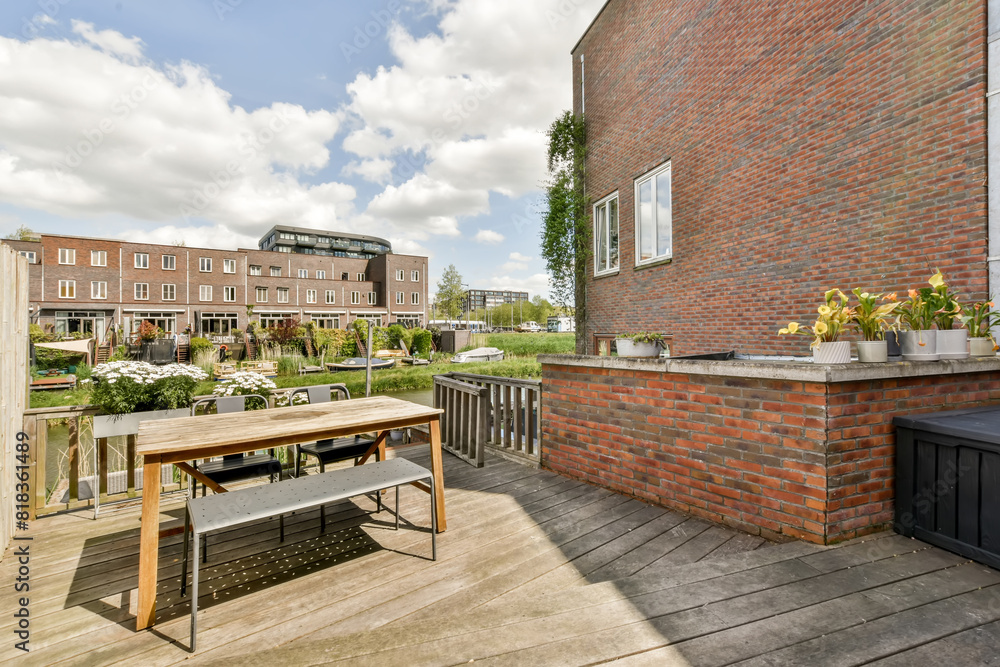 Urban patio with dining area and lush green surroundings Urban patio with dining area and lush green surroundings