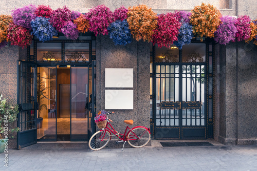 Charming Madrid building entrance with flowers and bicycle photo
