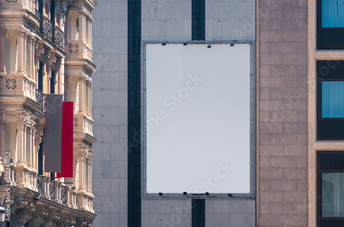 Blank Billboard on Building Facade in Madrid City photo