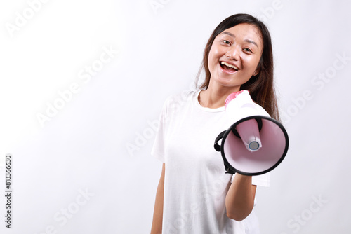 Young asian woman hold scream shout in megaphone announces discounts sale Hurry up isolated on white background studio portrait.