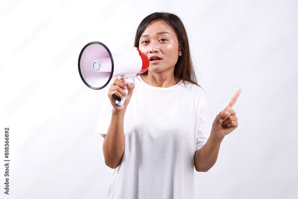 Strict woman of Asian ethnicity 20s wear white shirt hold megaphone announces warning, discounts sale Hurry up point finger up warns isolated on white background People lifestyle concept Strict woman of Asian ethnicity 20s wear white shirt hold megaphone announces warning, discounts sale Hurry up point finger up warns isolated on white background People lifestyle concept