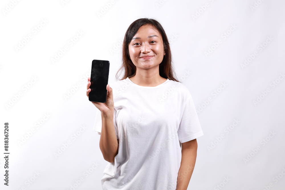 Attractive pleasant asian woman present new phone app, hold smartphone show telephone screen, introduce application on display, stand white background delighted Attractive pleasant asian woman present new phone app, hold smartphone show telephone screen, introduce application on display, stand white background delighted