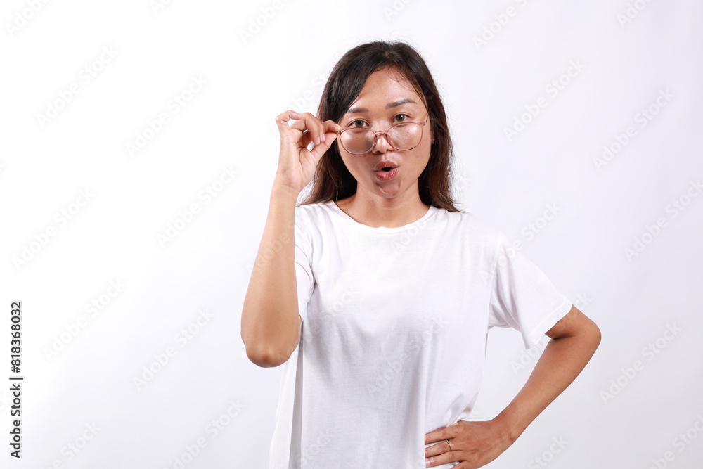 Portrait of amazing beautiful woman standing while taking off her eyeglasses. Isolated on white background Portrait of amazing beautiful woman standing while taking off her eyeglasses. Isolated on white background