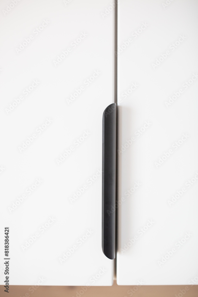 Obraz premium Modern white cabinet handle close up
