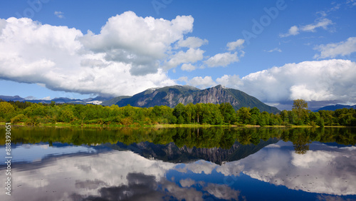 Mount Si reflects in Borst Lake with white partly cloudy sky in spring in Snoqualmie Washington © IanDewarPhotography