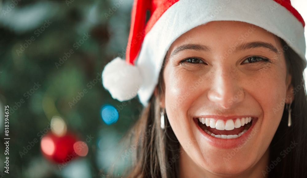 Christmas hat, woman and face with smile in closeup for celebration of winter or December holidays at home. Happy, female person and xmas with ornaments and decoration on tree for festive season Christmas hat, woman and face with smile in closeup for celebration of winter or December holidays at home. Happy, female person and xmas with ornaments and decoration on tree for festive season