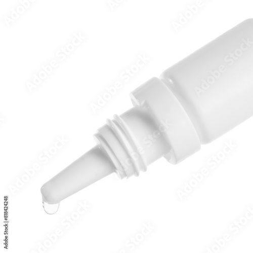Dripping medical drops from bottle on white background