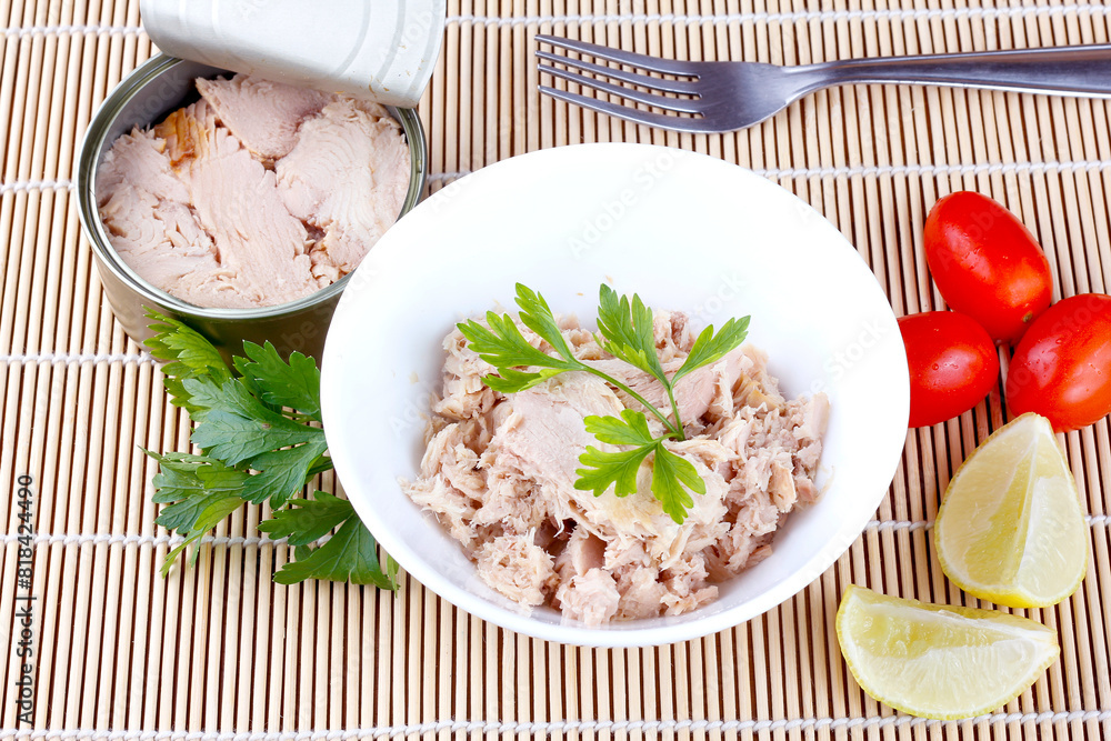 canned tuna in ceramic bowl isolated on bamboo mat top view canned tuna in ceramic bowl isolated on bamboo mat top view