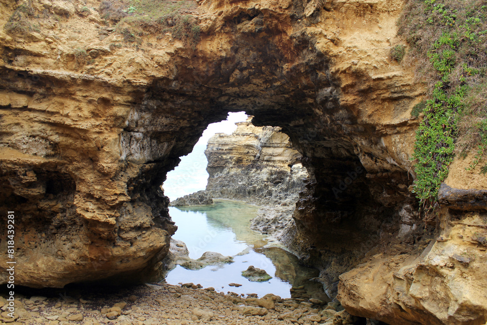 Natural rock formation with an archway at The Grotto on the Great Ocean Road in Victoria, Australia