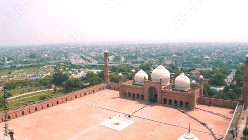 view of the biggest mosque of city From sky with drone camera. Badshahi Mosuqe in Lahore view from air with drone camera.  photo