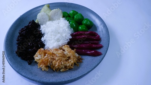 Cenil or gurandil is a various Indonesia snack made from cassava wrapped in grated coconut isolated white background. photo