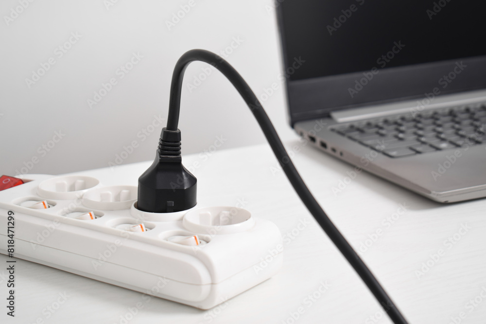 Electrical plug in outlet socket at home. Outlet, Electric Plug, Power Cable, Electrical equipment, electrical wires and power strips in the house Electrical plug in outlet socket at home. Outlet, Electric Plug, Power Cable, Electrical equipment, electrical wires and power strips in the house