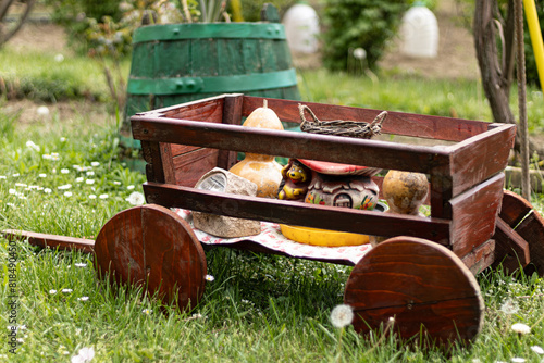 A wooden cart as garden decoration.