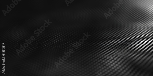 Black and gray carbon fiber surface with light reflection AIG51A. photo