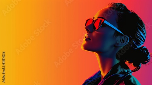 Stylish woman in sunglasses looking up, illuminated by vibrant gradient lighting, evoking a modern, fashionable, and futuristic vibe.