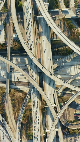 Bird's-eye view of the bustling Judge Harry Pregerson Interchange, featuring the I-105 and I-110 freeway crossing. 4K footage.  photo