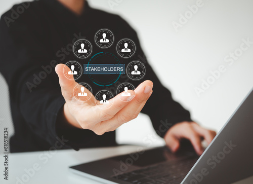 Stakeholders concept. Person touching stakeholders icon on virtual screen for business finance stakeholder investment management. Different stakeholders contact collaboration for company organization