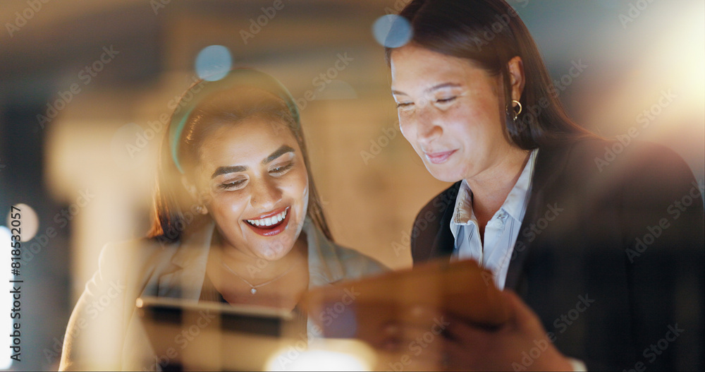 © peopleimages.com - Laptop, tablet and collaboration with business people at night in the office together for teamwork. Technology, smile and a happy employee team of women working on a project or report in the evening