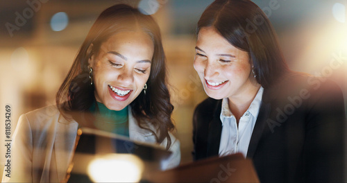 Laptop, tablet and collaboration with business people at night in the office together for teamwork. Technology, smile and a happy employee team of women working on a project or report in the evening