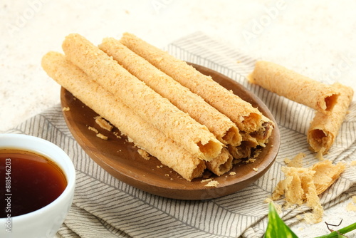 Egg Roll Biscuit or Kue Semprong or sapit, Simping, kue Belanda, or kapit or Love letters in English. It is an Indonesian traditional wafer snack