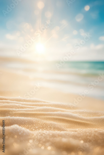 Abstract blur defocused background, nature of tropical summer beach with rays of sun light. Golden sand beach, sea water against blue sky with white clouds. Copy space, summer vacation concept.