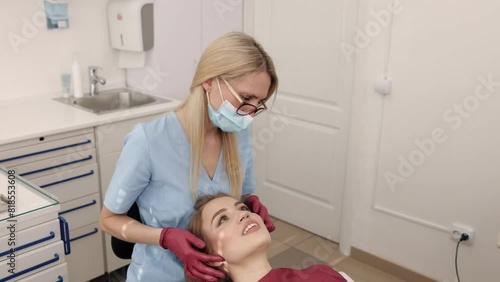 Jaw check, Joint palpation, Dental procedure. Gnathologist and orthodontist is carrying out palpation woman's jaw joints. photo