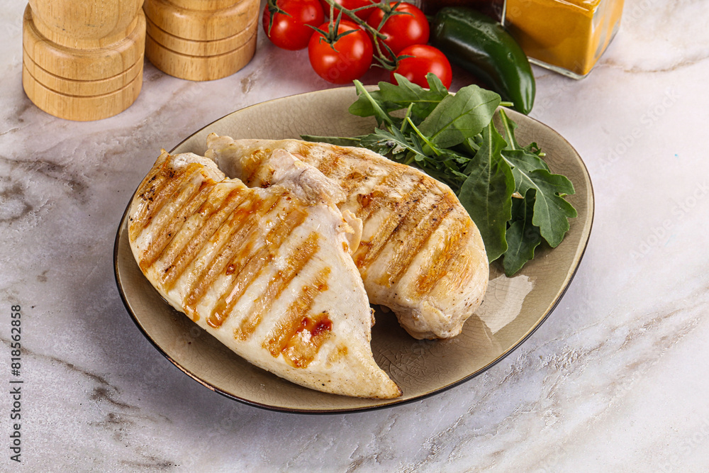 Grilled chicken breast served arugula Grilled chicken breast served arugula
