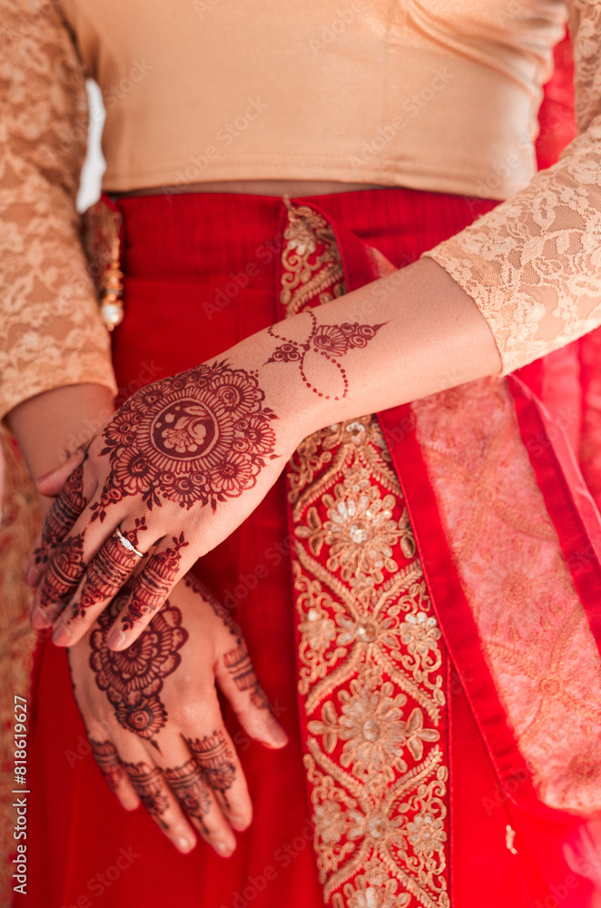 Indian bride, hands and henna for wedding, celebration and love for marriage. Woman, mehndi and culture with traditional temporary tattoo, sari and hindu bridal jewelry with accessory and red veil
