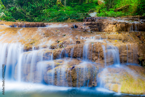 Water flows softly at Than Sawan Waterfall in Doi Phu Nang National Park
