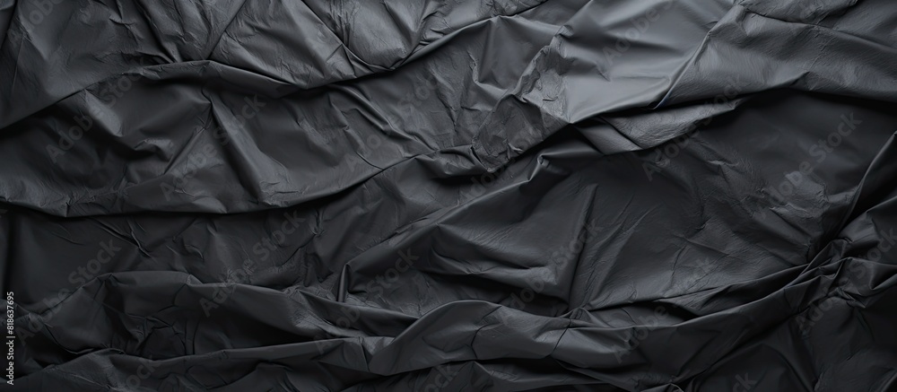 The dark paper with a creased texture serves as the background for the copy space image The dark paper with a creased texture serves as the background for the copy space image