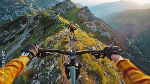 Riding a mountain bike along a narrow ridge with breathtaking views on either side.