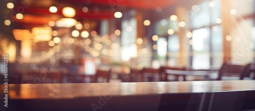 A restaurant or food center with a blurred image and a background featuring bokeh lights Copy space image