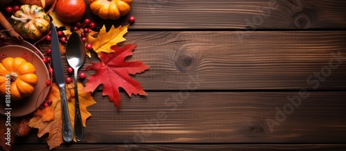 Wallpaper Mural A festive autumn table with cutlery and vibrant fall leaves perfect for Thanksgiving Copy space image 86 characters Torontodigital.ca