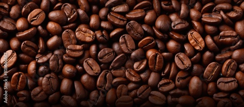 A background image featuring roasted coffee beans with copy space